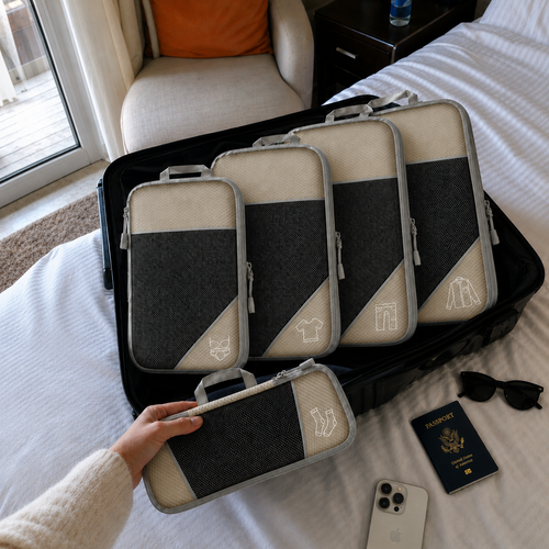 Travel packing cubes neatly separating clothes, shoes and accessories