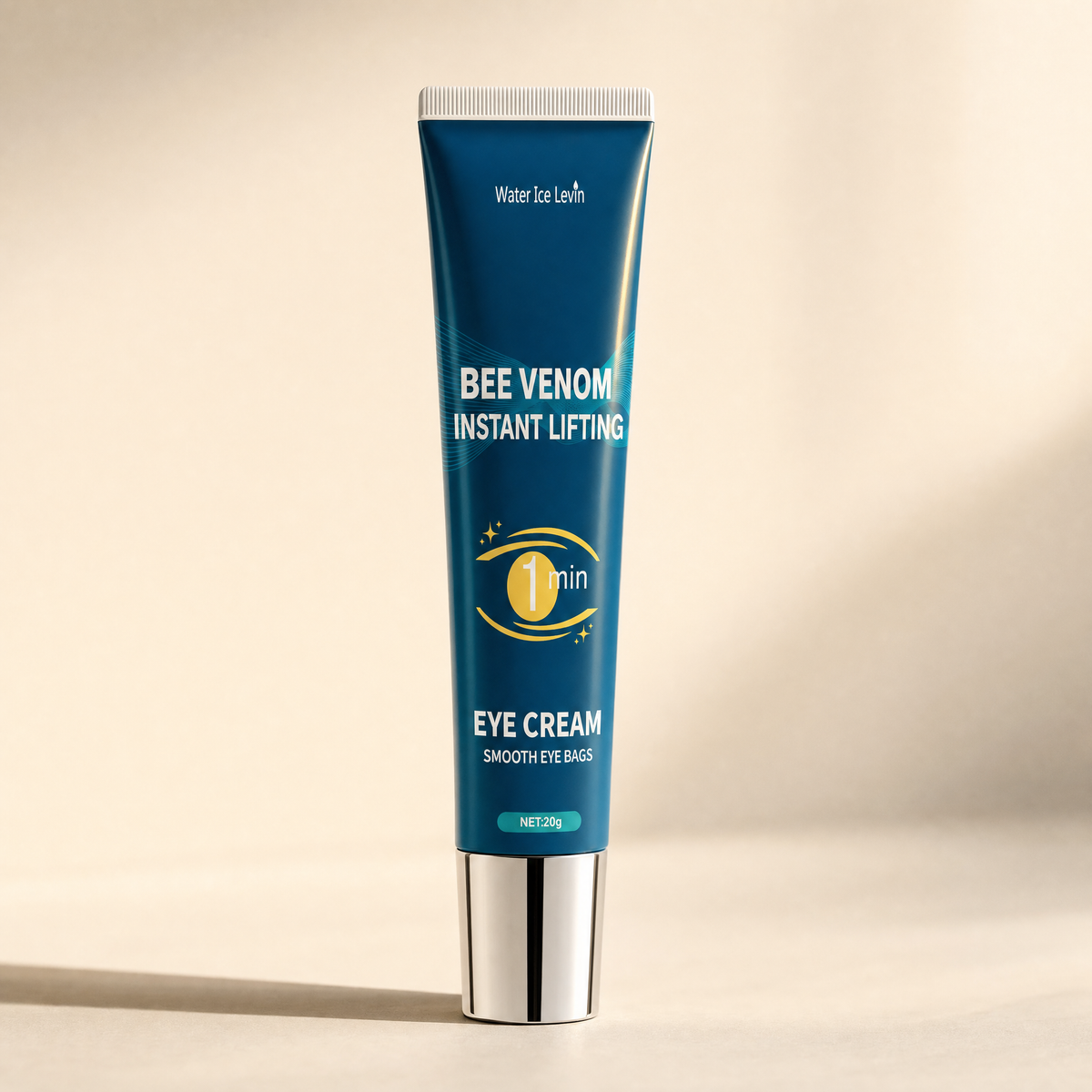 Bee Venom Instant Lifting eye gel tube on a warm cream studio background